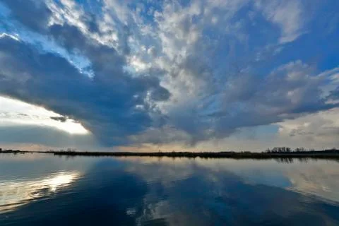 Beautiful spring sunset on the river. Stock Photos