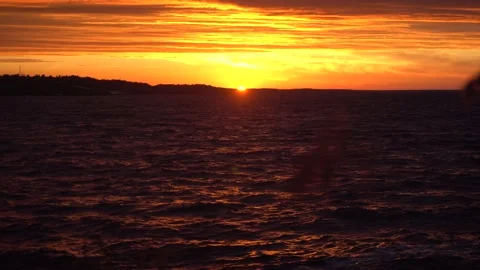 Beautiful spring sunset by the sea. orange textured sky. wild beach. Stock Footage 158170733