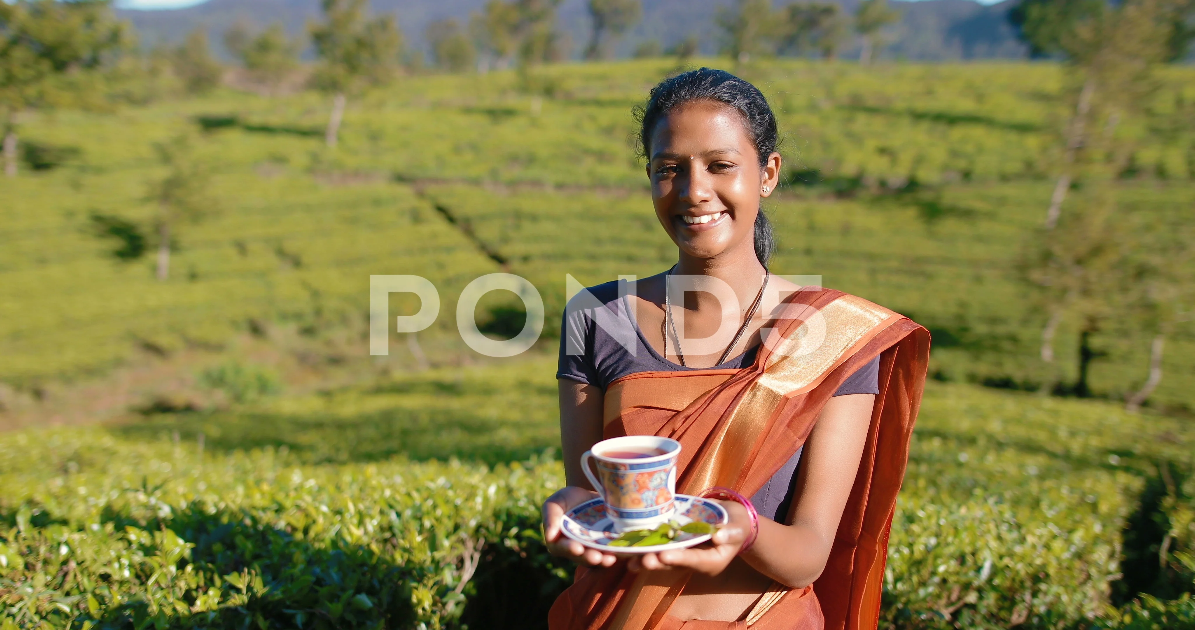 Beautiful Sri Lankan girl with a cup of ... | Stock Video | Pond5