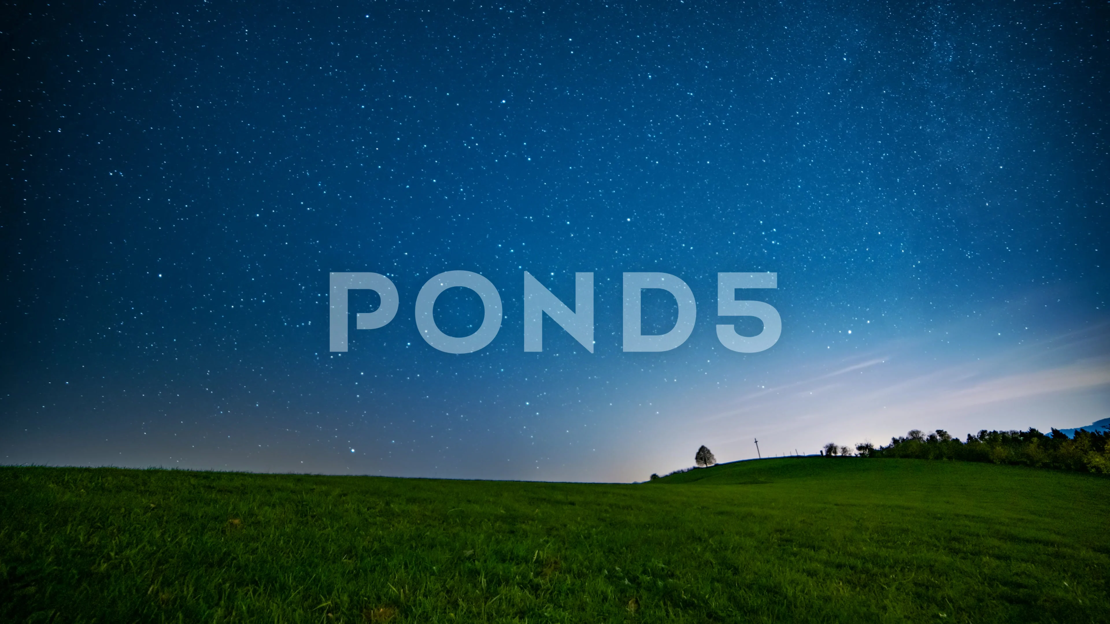 Beautiful starry sky above the grassland... | Stock Video | Pond5