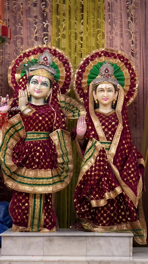 Beautiful Statue of Lord Krishna with Radha in Traditional Attire Stock Footage 316895175