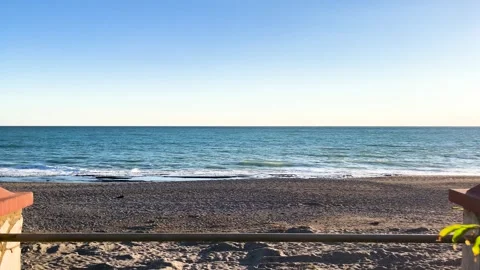 Beautiful Still shot of the Ocean Waves Gently Washing Ashore during summer Stock Footage 297430446