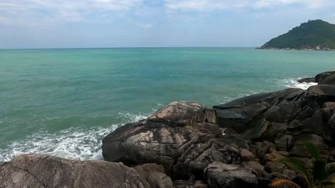 Beautiful stone shore on which small waves break. Stock Footage 230078748