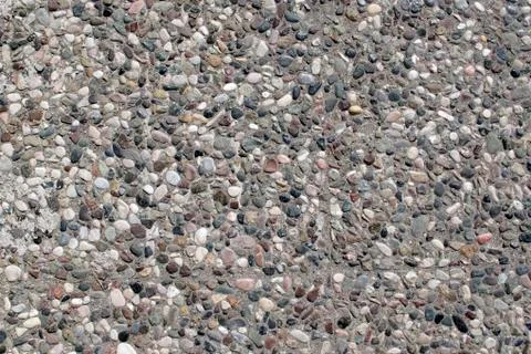 Beautiful stone wall background texture. pebble texture in concrete, small pe Stock-Fotos