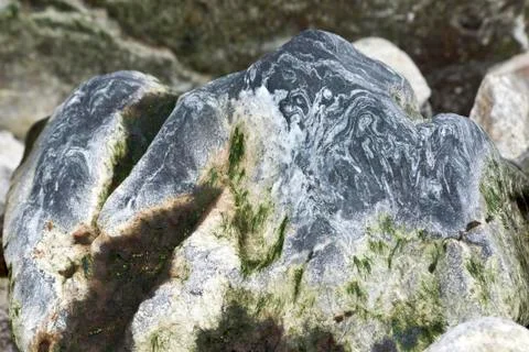 Beautiful stone with a wavy pattern of the antarctic strait. Stock Photos