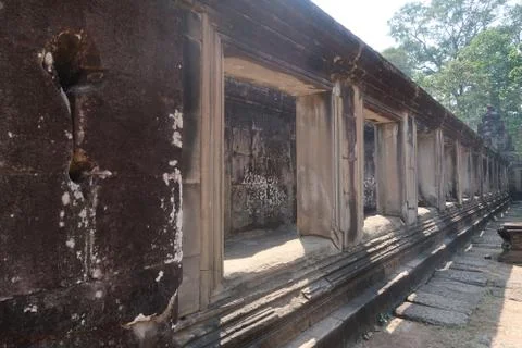 Beautiful stone windows lined up to inner courtyard in ancient angkor wat temple Stock Photos