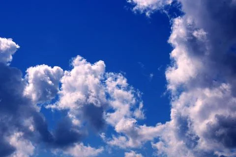 Beautiful storm clouds on the blue sky. An approaching storm. Stock Photos