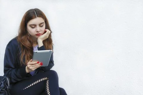 A beautiful student girl using a computer, laptop Stock Photos