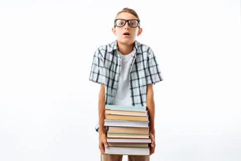Beautiful student holding a stack of books, botany glasses hard to keep a lar Stock Photos