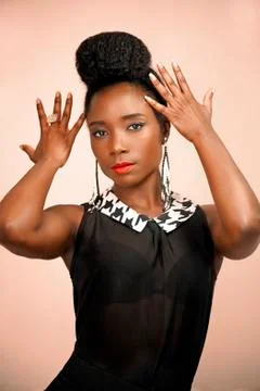 Beautiful stylish African woman posing confidently  Stock Photos