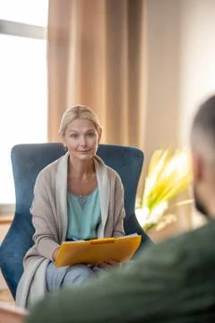 Beautiful stylish psychologist having conversation with patient Stock Photos