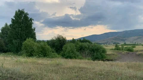 Beautiful summer landscape. Panoramic view of majestic mountains, meadows and Stock-Footage 134549443