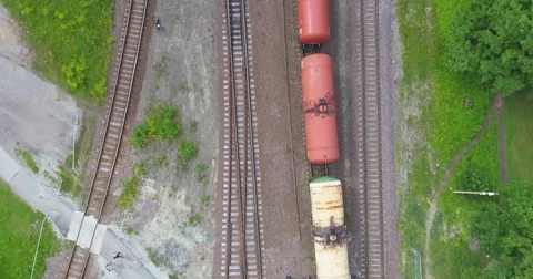 Beautiful summer nature and cargo train, runs through the city. Aerial footage. Stock Footage