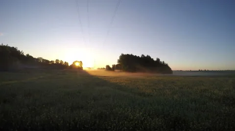 Beautiful summer sunrise on farm field with morning mist fog. Timelapse 4K Stock Footage