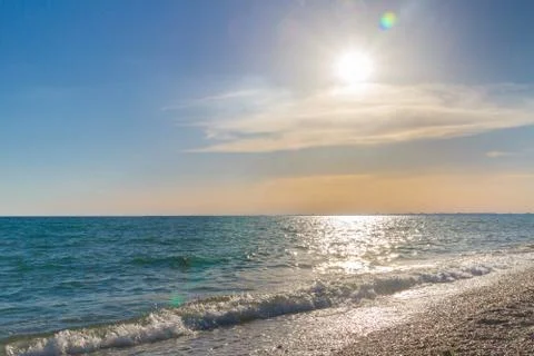 Beautiful summer sunset with clouds over the sea Stock Photos