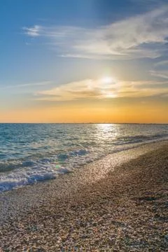 Beautiful summer sunset with clouds over the sea Stock Photos
