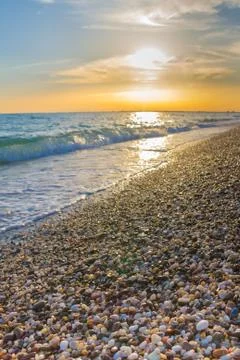 Beautiful summer sunset with clouds over the sea Stock Photos