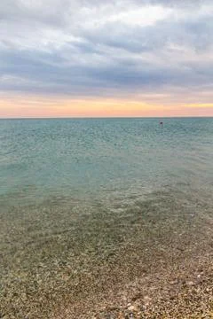 Beautiful summer sunset with clouds over the sea Stock Photos