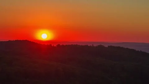 Beautiful summer sunset over forest in cinematic timelapse Stock Footage 333555632