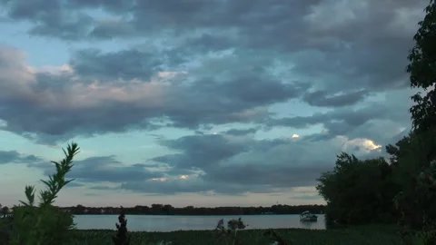 A Beautiful Summer Sunset on the River Stock Footage 169666380