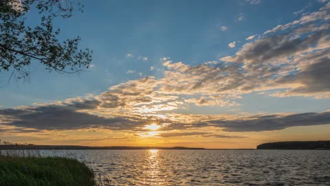 Beautiful summer sunset. View from the river embankment. Timelapse. 4K Stock Footage 155079039