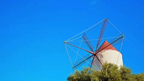 Beautiful sun over windmill red coloured in Es Mercadal town in Menorca, Spain. Stock Footage 249310609