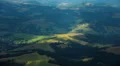 Beautiful sun rays between the clouds float across the surface of the earth HD Footage