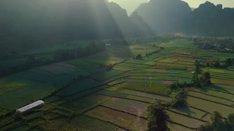 Beautiful sun rays shining over mountainous background with mystic fertile Stock Footage 267661142