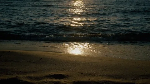 Beautiful sun reflection on the sandy beach Stock Footage 124750361