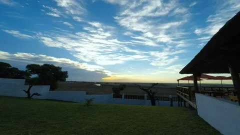 A beautiful sun sets behind the horizon. Africa. The view from the restaurant. Stock Footage 71404845