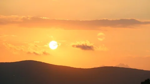 Beautiful sun sets behind the mountain Stock Footage 107398278