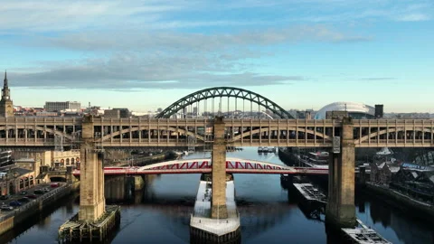 Beautiful Sun sets over the High Level Bridge as we lift up to reveal the Stock Footage 257649377