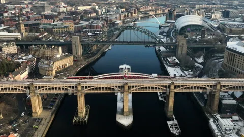 Beautiful Sun sets over The high level bridge and Tyne Bridge. Slow pull Stock Footage 257649478