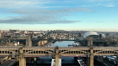 Beautiful Sun sets over the High Level Bridge as we descend to reveal the Stock Footage 257671102