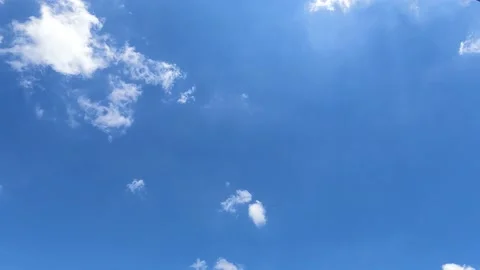 Beautiful sunny clear navy blue sky with puffy fluffy white clouds Stock Footage 156182853