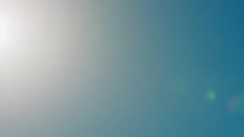Beautiful sunny cloudless clear sky with bright sun shining with sunlight ray Stock Footage 156227499