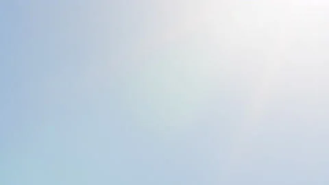 Beautiful sunny cloudless clear sky with bright sun shining with sunlight ray Stock Footage 156228571