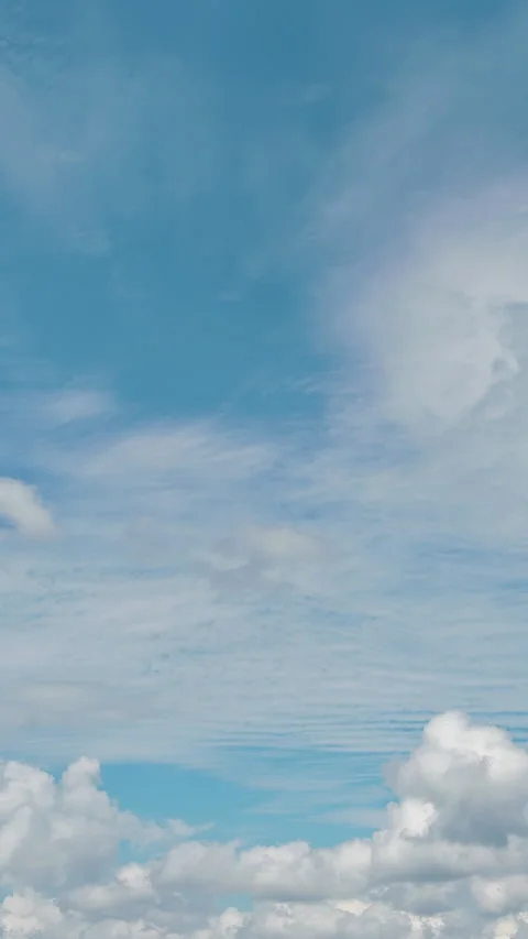 In a beautiful sunny cloudscape, we fly through heavenly fluffy clouds moving Vídeos de archivo 262779329