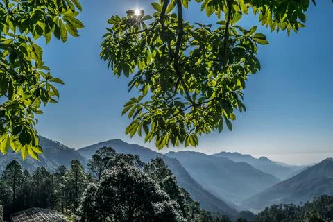 A beautiful sunny day in Himalayan range, The sun is visible from the side of Stock Photos