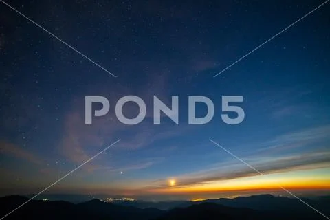 The beautiful sunrise above the city in mountains Stock Photos