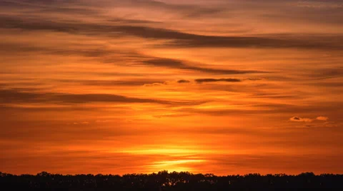The beautiful sunrise against the cloud stream. Time lapse. Telephoto lens Stock Footage 64103261