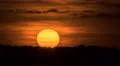 The beautiful sunrise against the cloud stream. Time lapse. Telephoto lens 4k or 4k+ Resolution