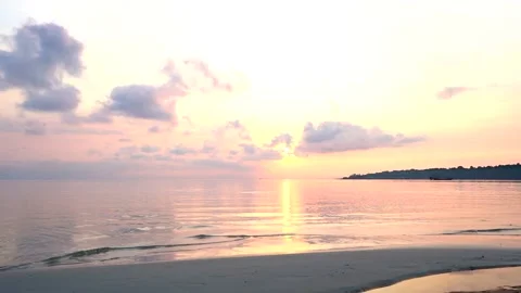 Beautiful sunrise on the beach - Early morning at sea, ocean Stock Footage