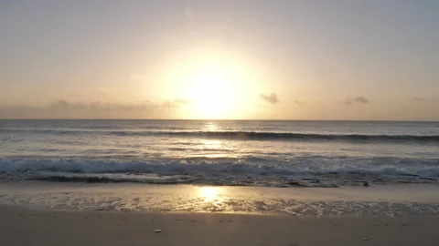 Beautiful Sunrise on Beach with waves lapping B Continuous Sequence Pt4 of 40 Stock Footage 242059639