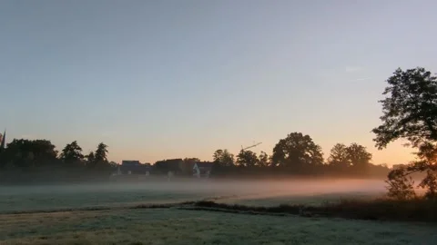 Beautiful sunrise emerging through thick fog. Stock Footage 319791686
