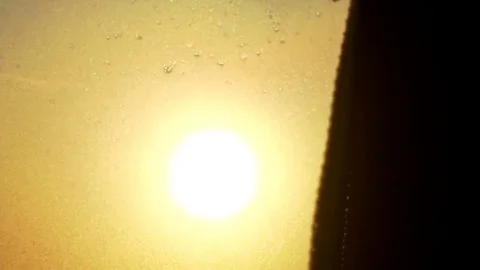 Beautiful sunrise flickering through trees and curtain from frosted bus window. 스톡 동영상 84760813