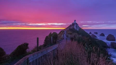 Beautiful sunrise at Nuggets Points, Catlins, New Zealand. Zoom Out Stock Footage 50101566