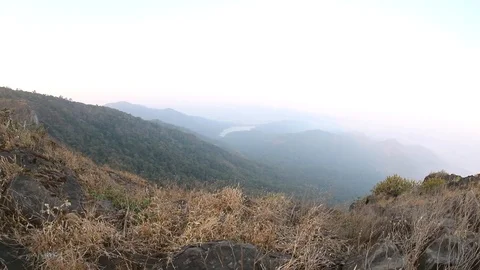 Beautiful sunrise over the mountain range at the tungareshwar mountain Stock Footage 123680732