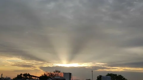 BEAUTIFUL SUNRISE PEEPING BETWEEN CLOUDS Video stock 238844838
