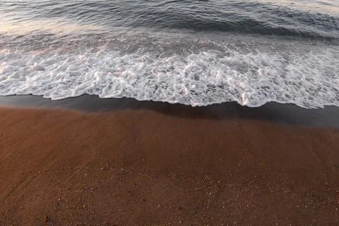 Beautiful sunrise on the sea with waves 스톡 사진